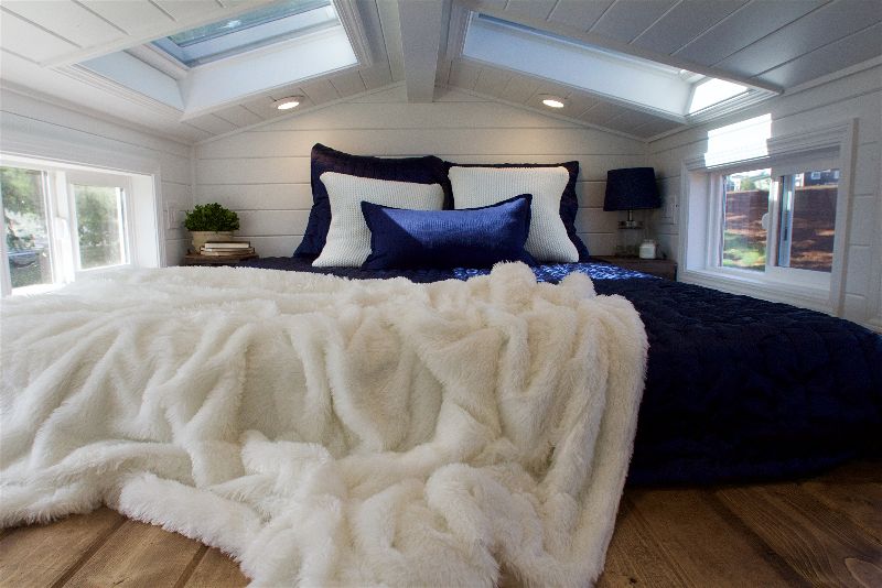 Loft bedroom in the Texan Tiny Farmhouse custom tiny home