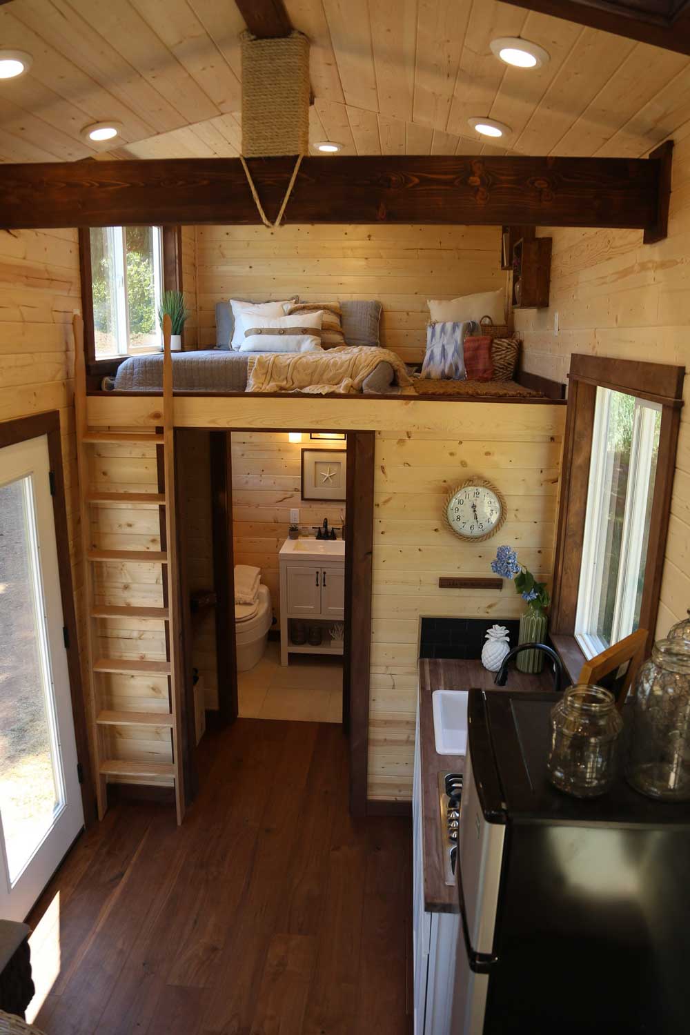 The Tropical Getaway custom tiny house's second loft and living room