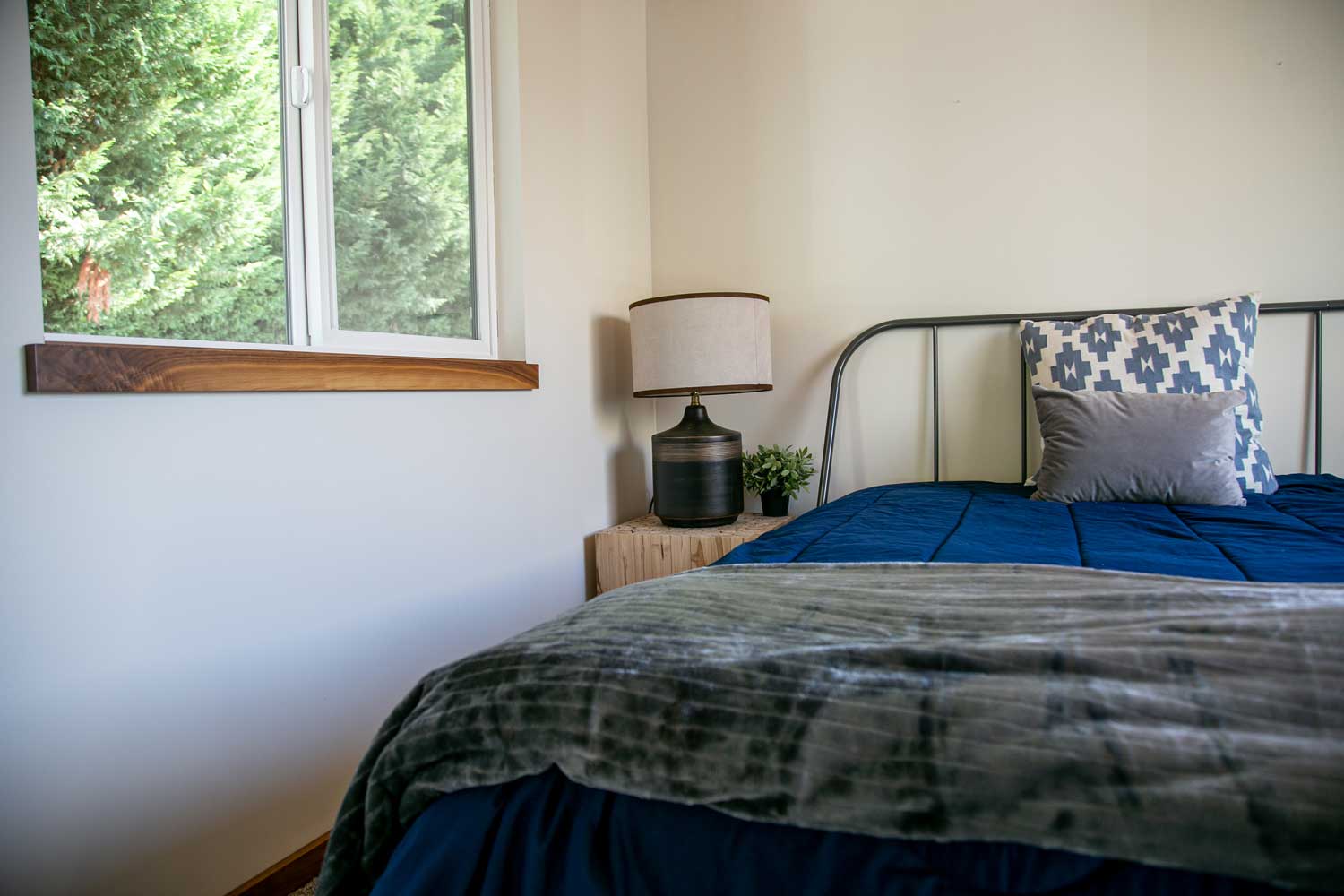 Bedroom of the Log Cabin custom tiny house