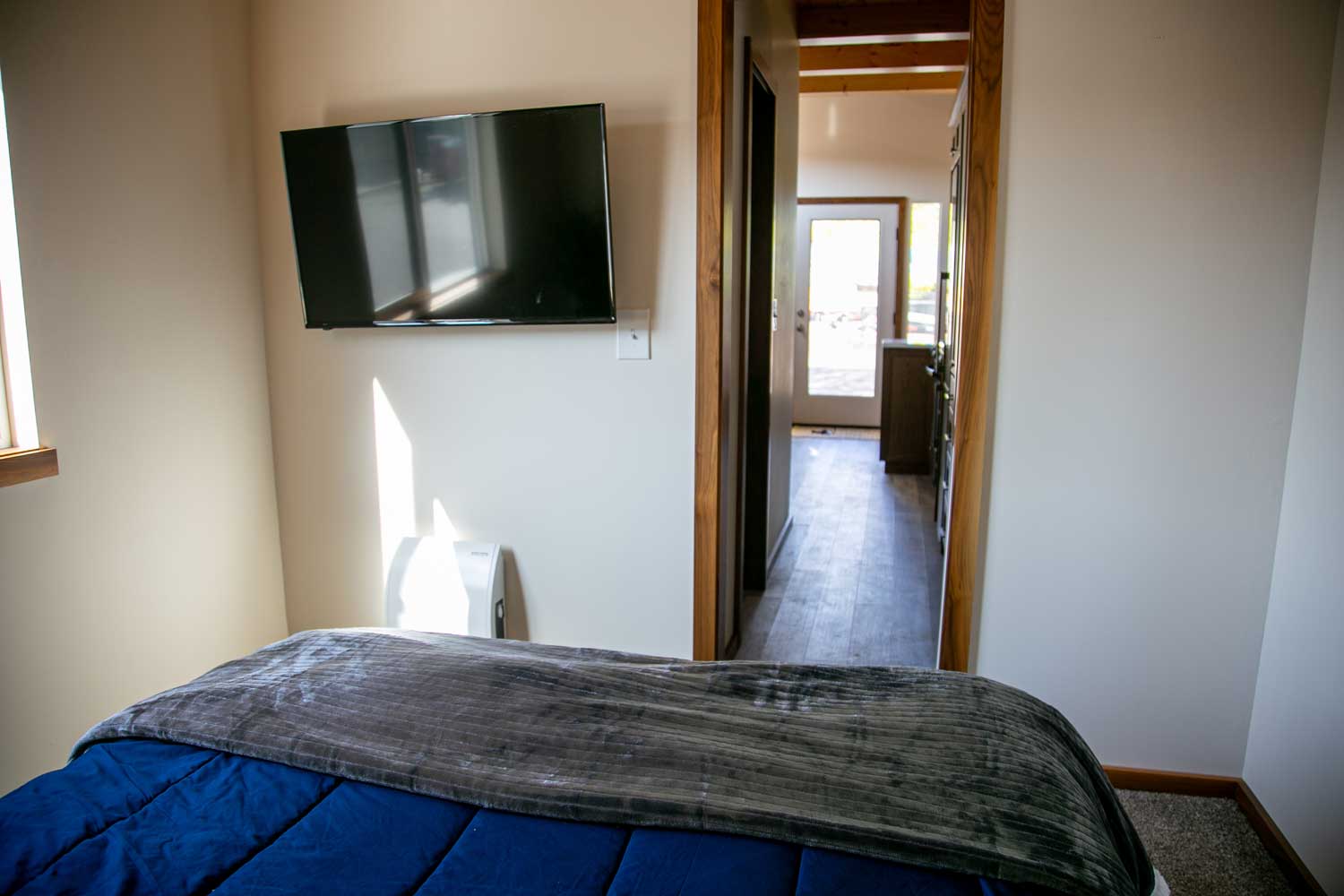 Bedroom in the Log Cabin custom tiny home