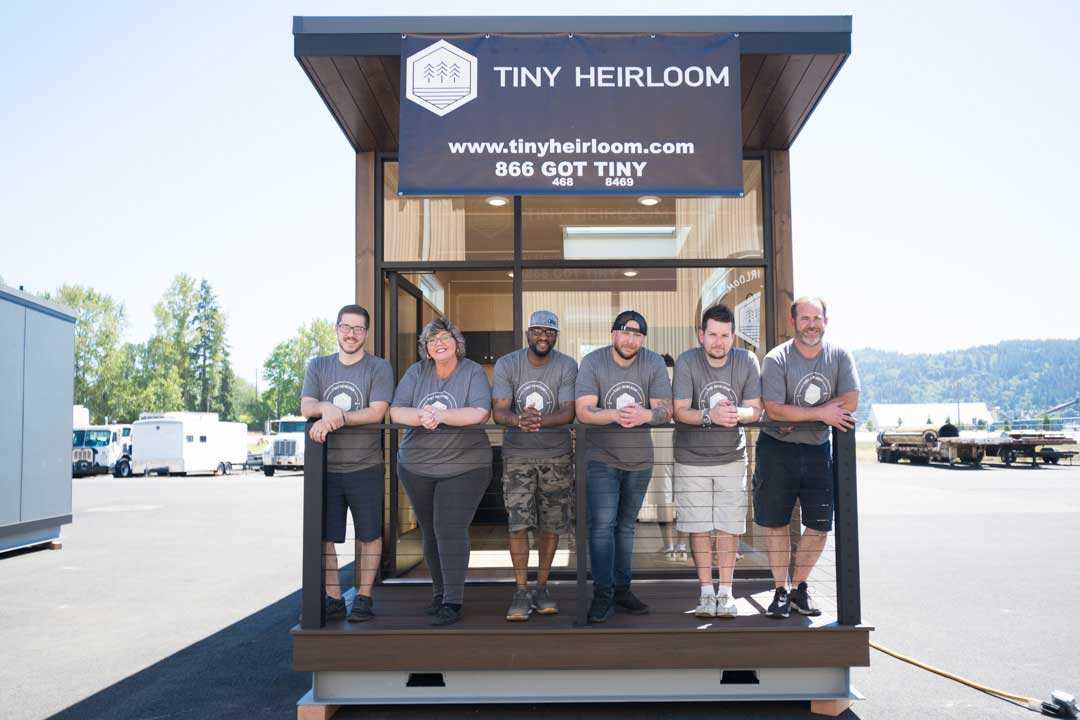 The Portland Tiny Heirloom tiny house builder Team in front of an eXpanse Tiny Home