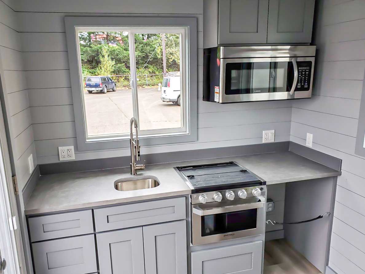 Kitchen of the True Blue custom tiny home