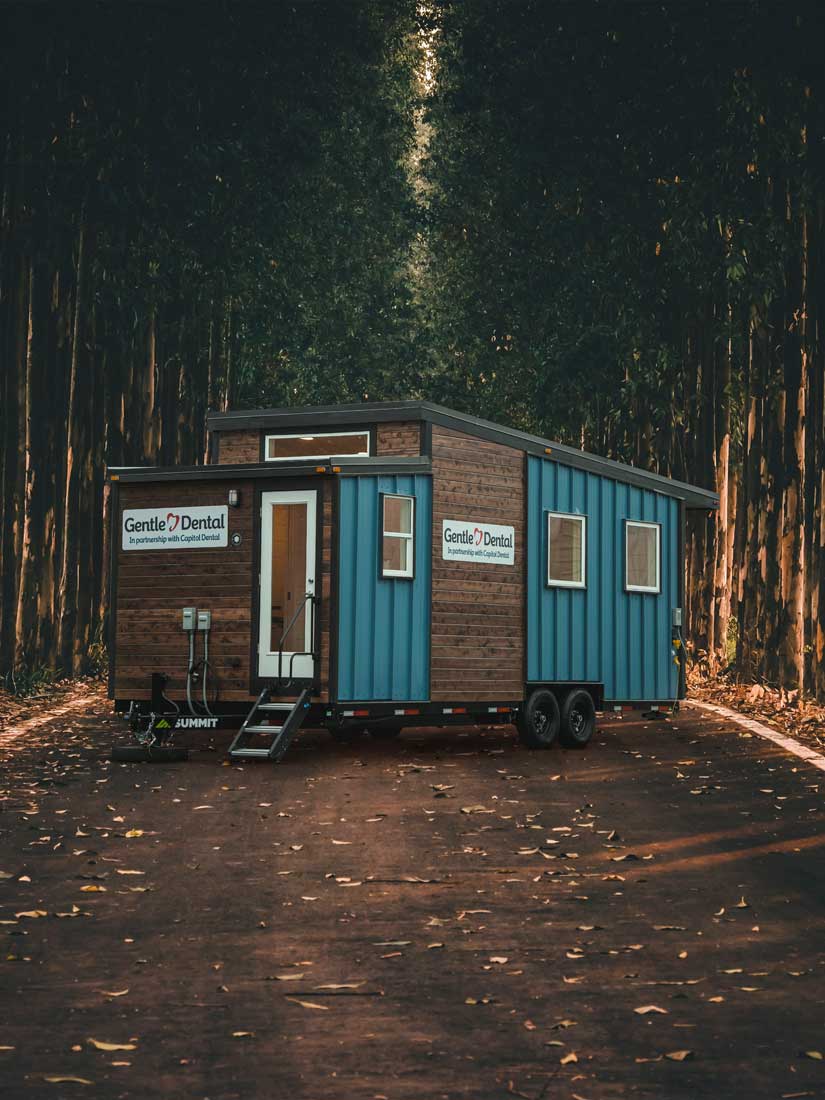 Gentle Dental mobile dentist office commercial tiny home exterior in forest